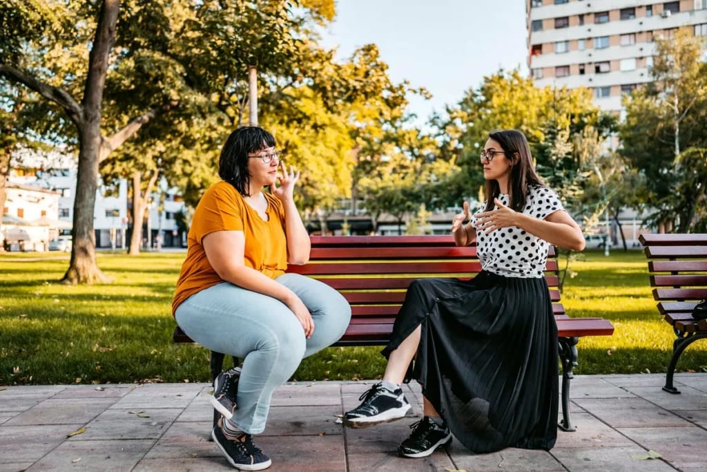 two people on park bench pELhneV.width .jpg