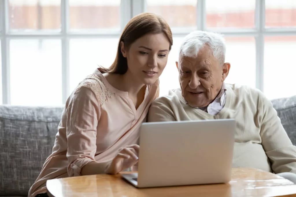 Yound adult woman looking at laptop and talki.width bTSCBAk.jpg