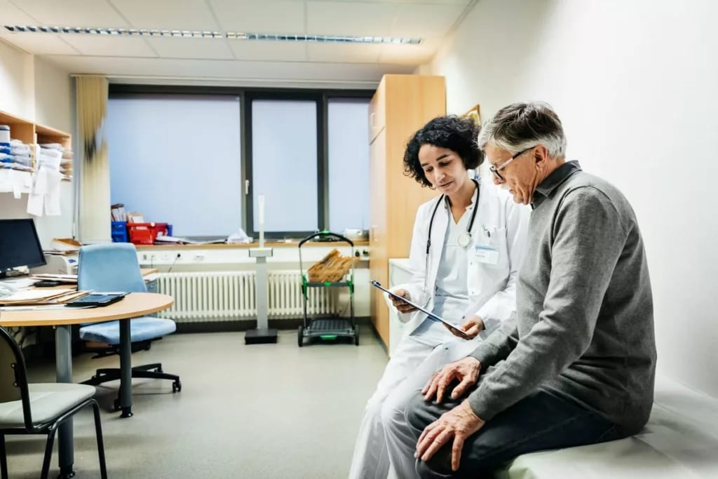 doctor with patient uIxsPm.width .jpg