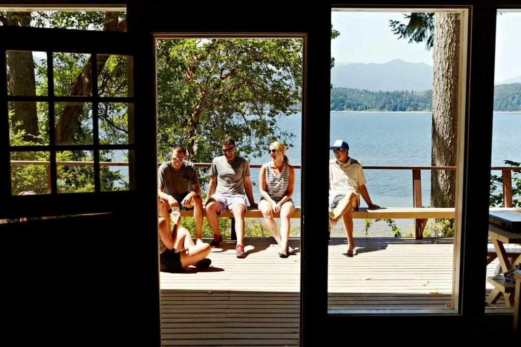 friends on deck of lake house sMCcwwu.width .jpg