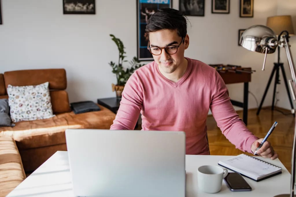 man s laptop smiling gettyimages .jpg
