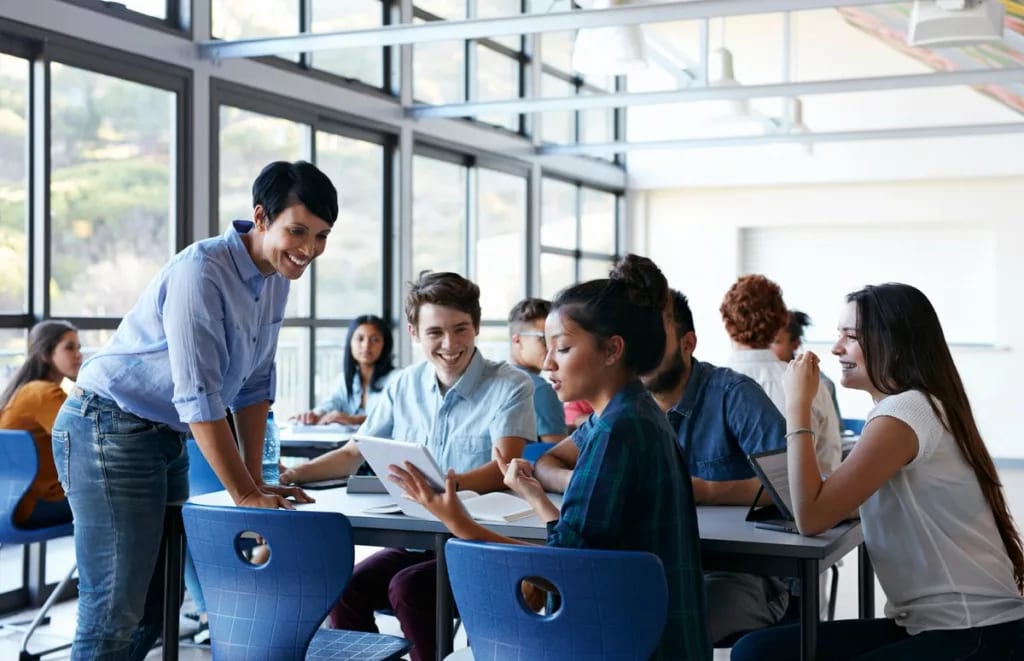 teacher and students at table UJsxz.width .jpg