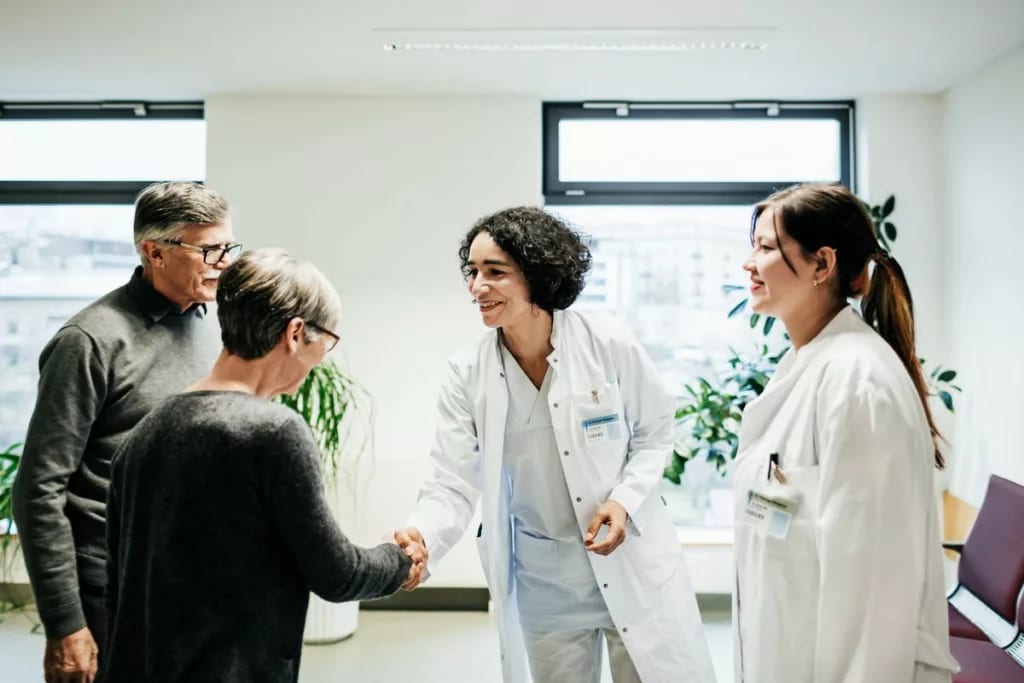 two people meeting two doctors wBbFA.width .jpg