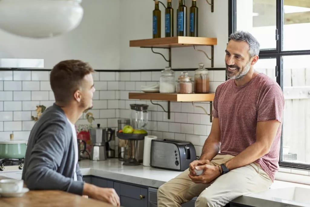 two people talking in kitchen STtBzNx.width .jpg