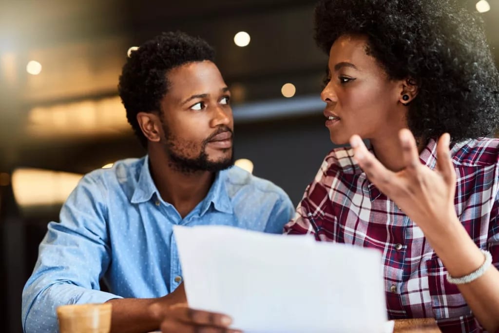 Couple dismayed by document in hands zNKqbht.width .jpg