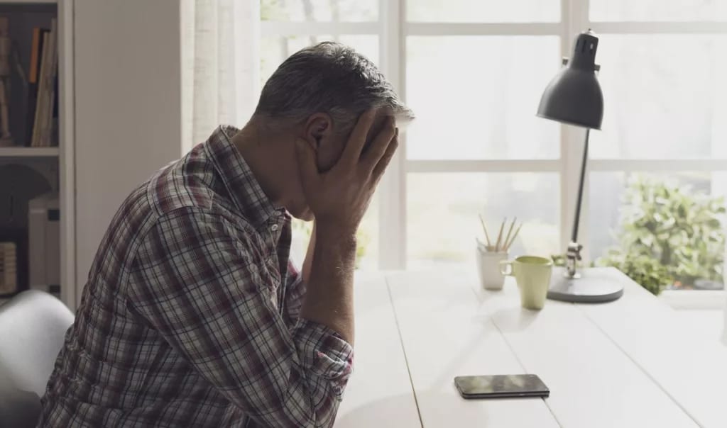 Upset man on phone HIaHrWt.width .jpg
