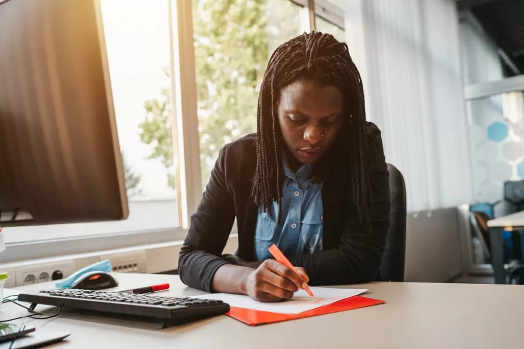 Woman highlighting a document gNOv.width .jpg