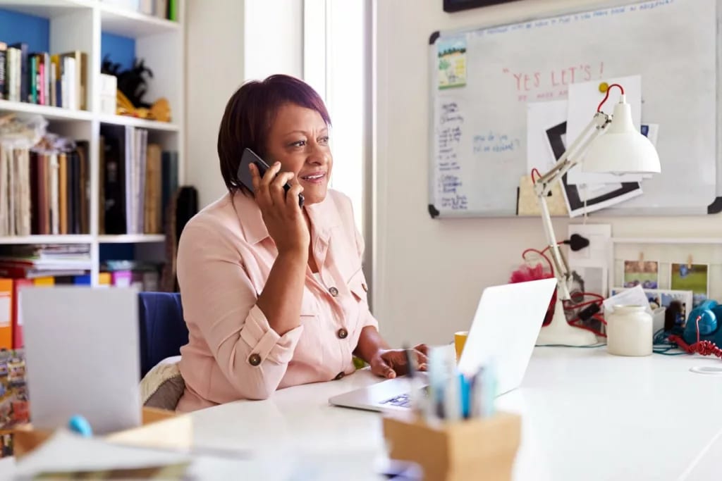 woman on phone in home office sgWiMth.width .jpg