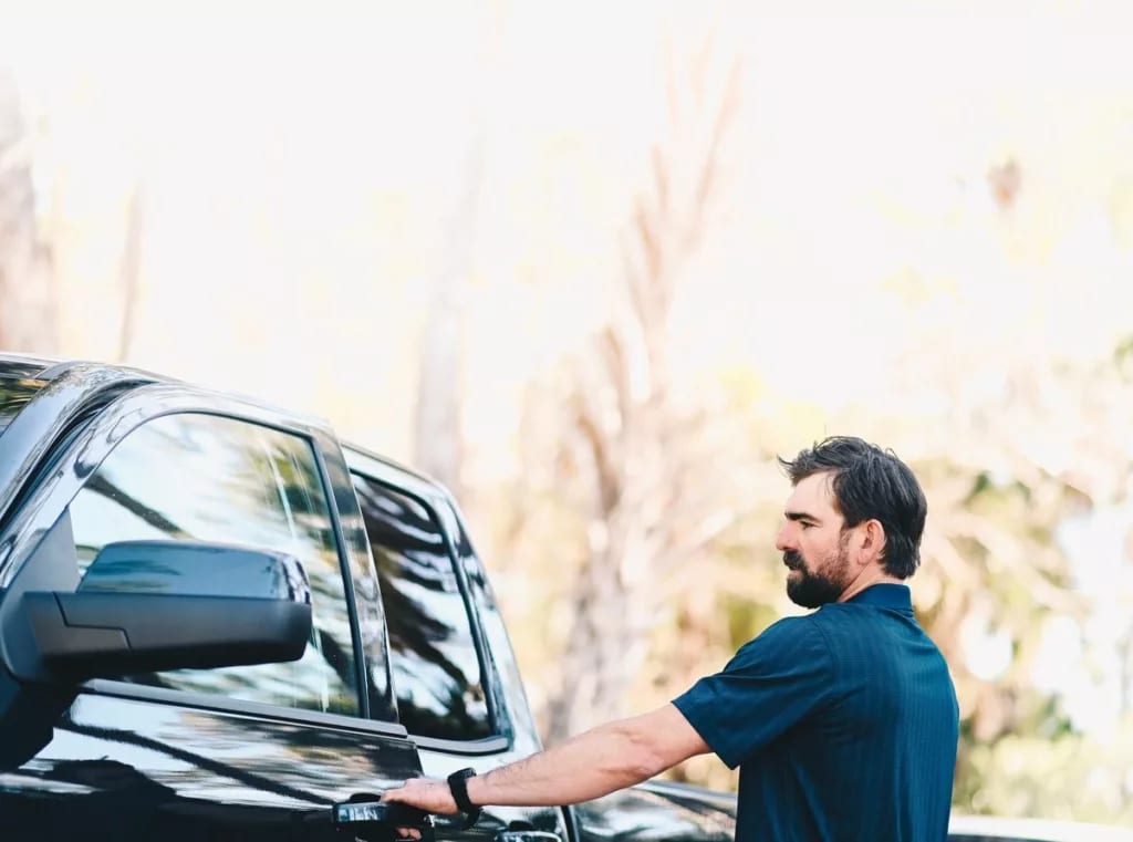 Man getting in to his pickup truck hqYKe.width .jpg