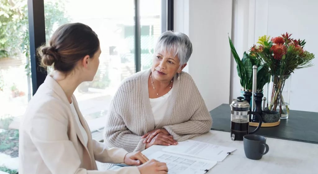 Older woman speaks with young professional Qk.width .jpg