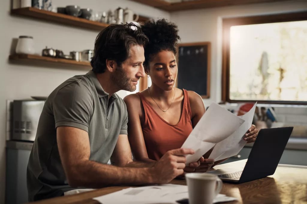 couple looking at paperwork together.jpg
