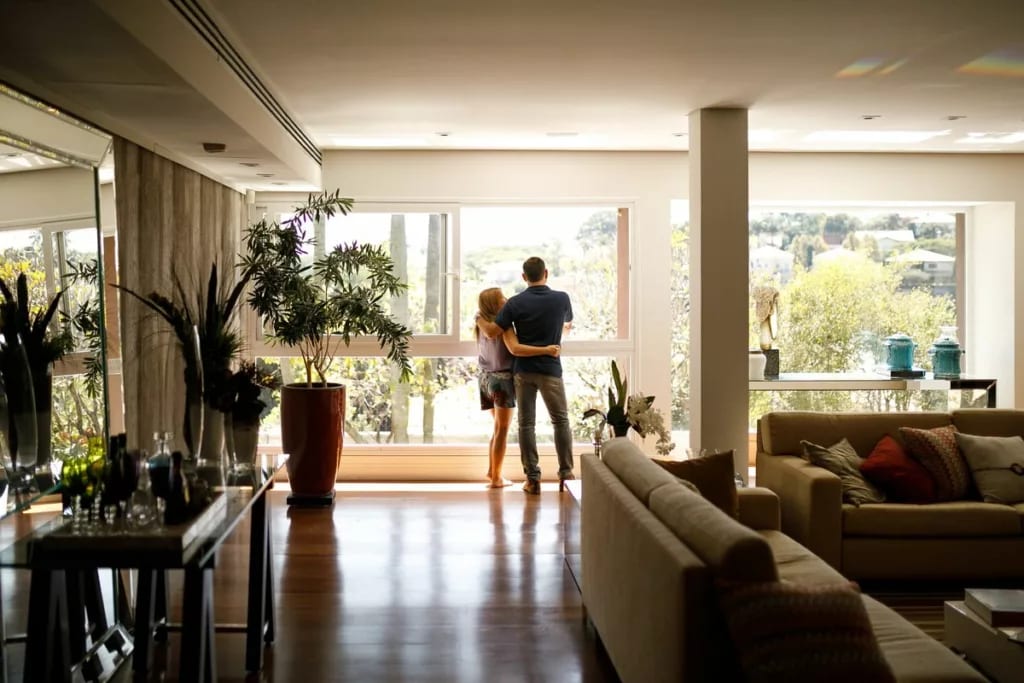 couple at window nice apartment VXdZl.width .jpg