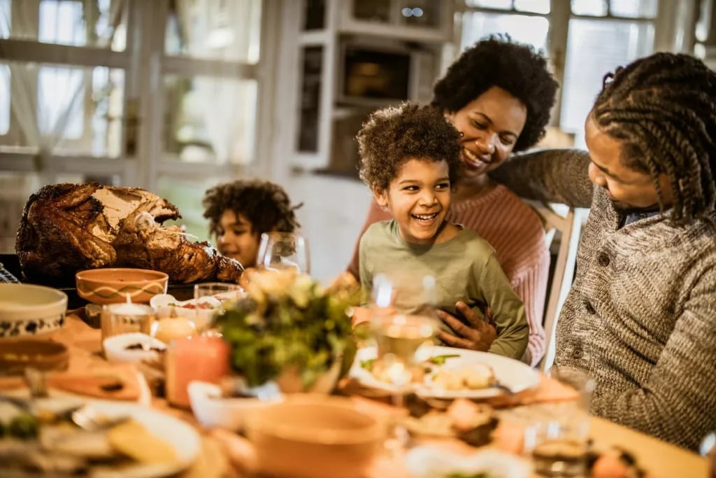 familly at thanksgiving table nifWbj.width .jpg