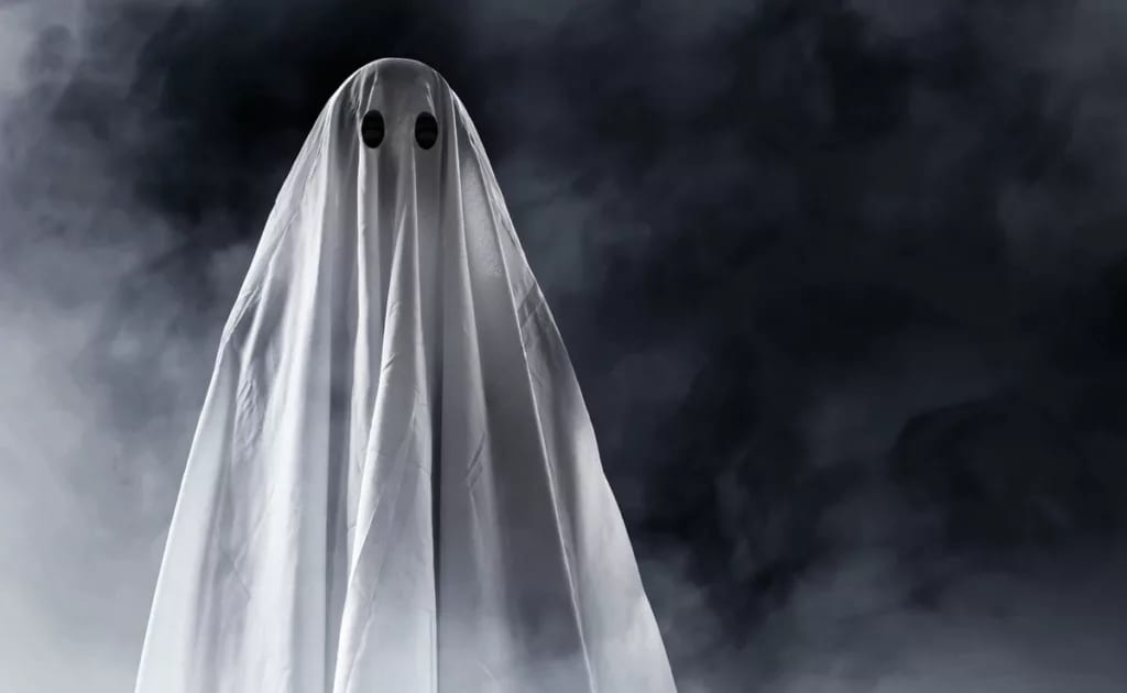 person wearing a sheet as a ghost costume for.width Cjgt.jpg