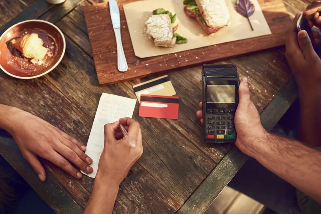 restaurant meal and credit card payment TAVB.width .jpg