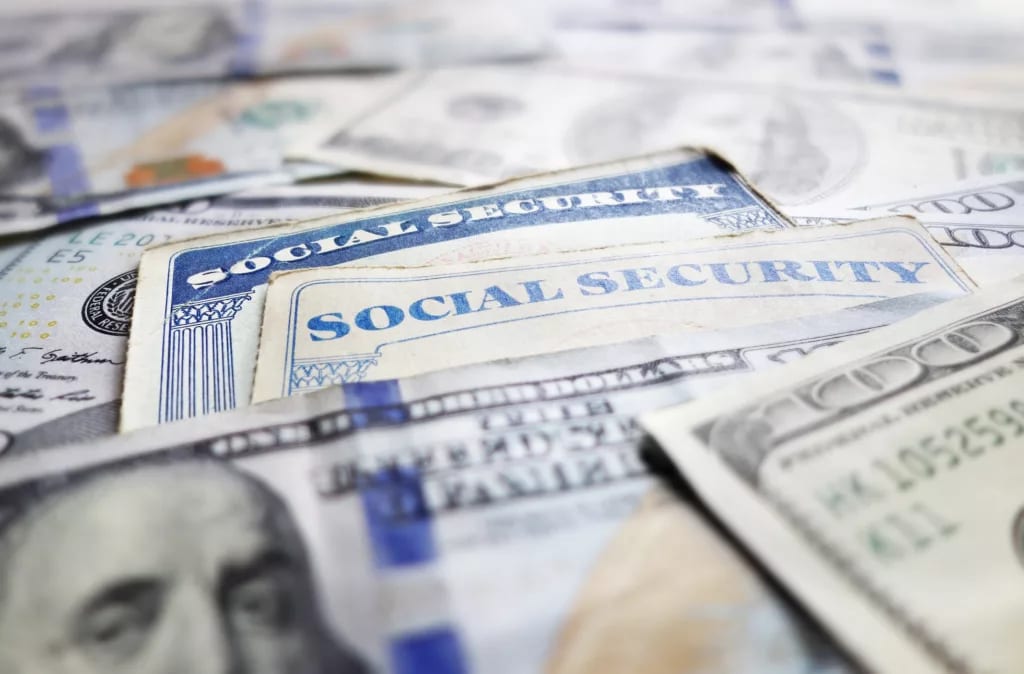 social security cards one hundred dollar cash bills money benefit getty.jpg