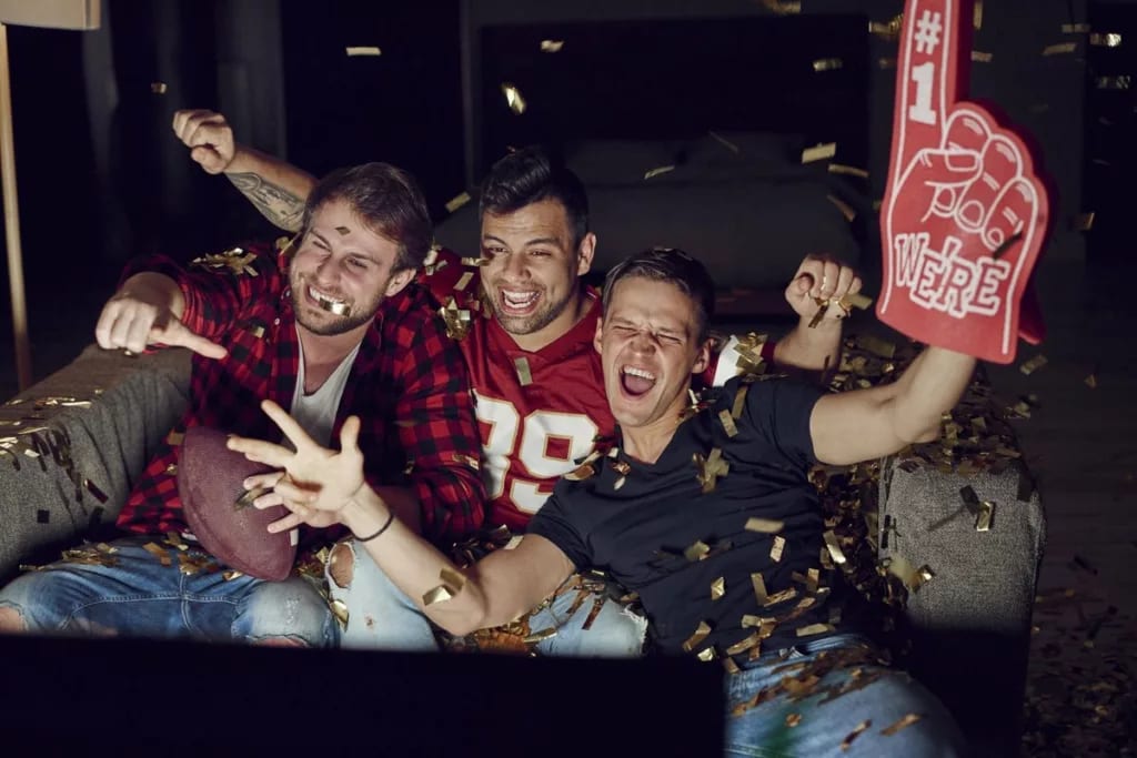 Men watching football on a televisio.width CUQIow.jpg