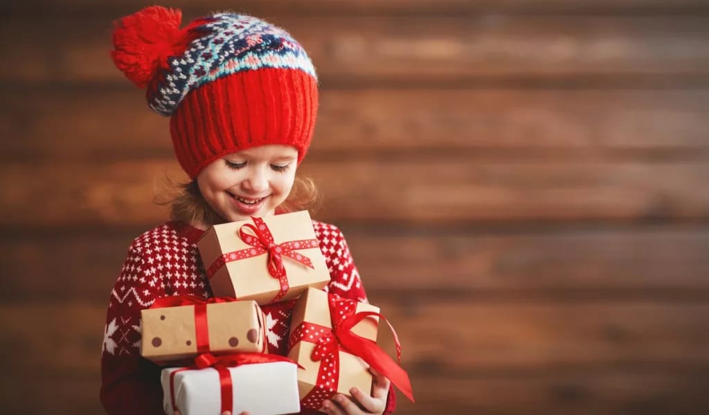 Child holding gifts WbYGu.width .jpg