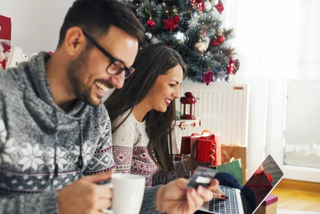Couple online Christmas shopping.width .jpg