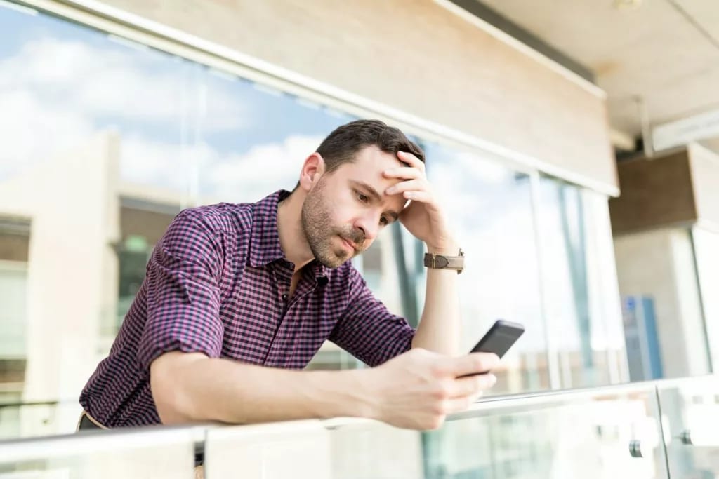 Man upset on phone AOMR.width .jpg