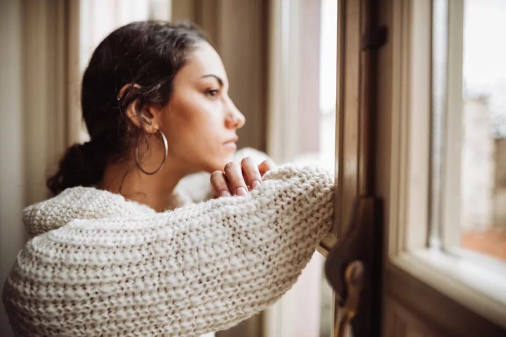 Stressed woman at window hdGj.width .jpg