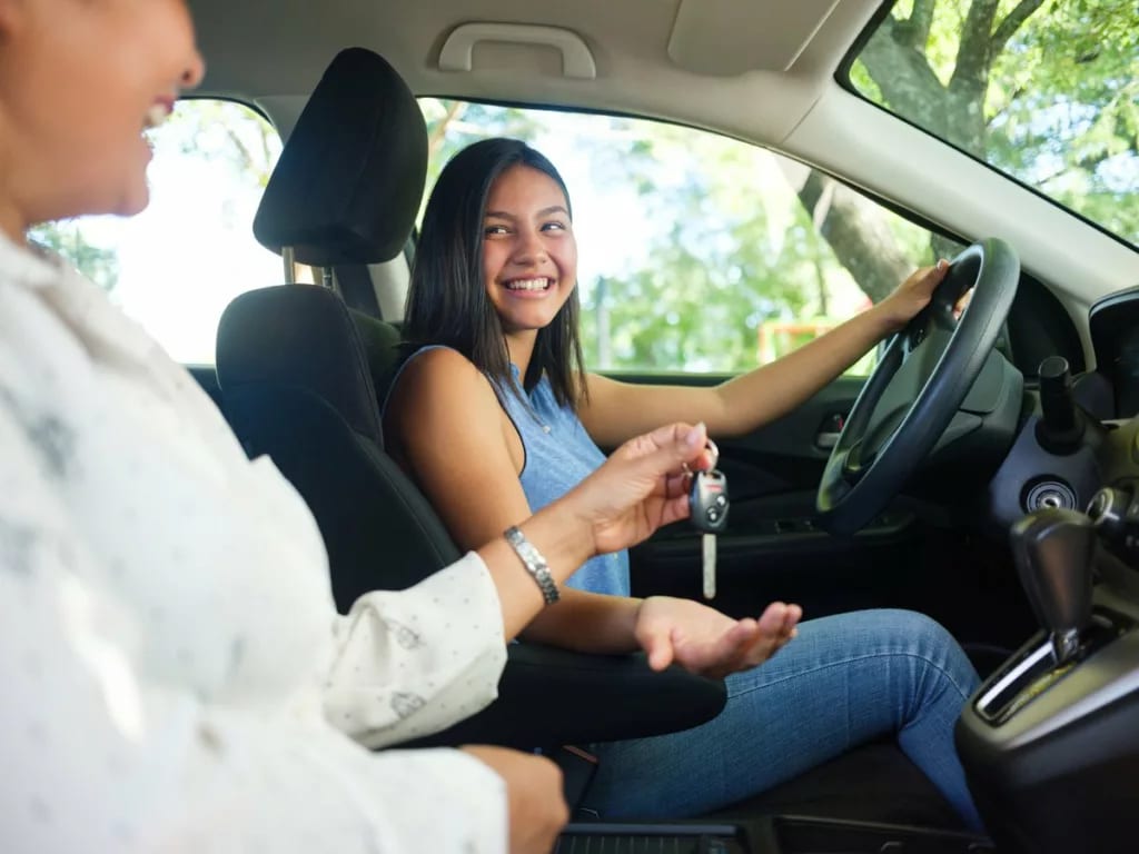 Teen girl in the drivers seat of a vehicle wi.width kDNtfu.jpg