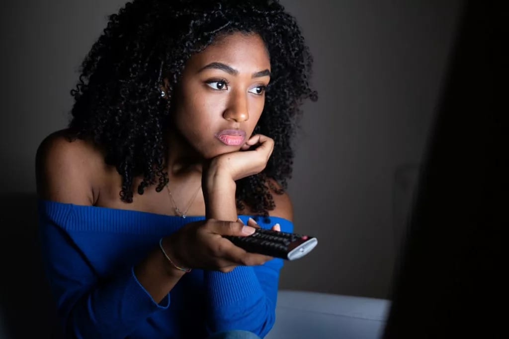 Woman watching tv VhCTBf.width .jpg