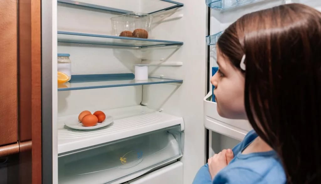Young girl opening up refrigerator to find it.width pkLQBCv.jpg
