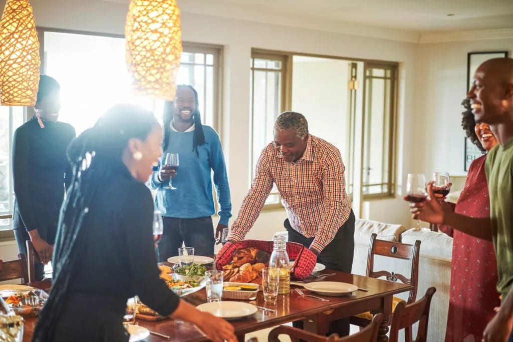 family at Thanksgiving table jIYUm.width .jpg