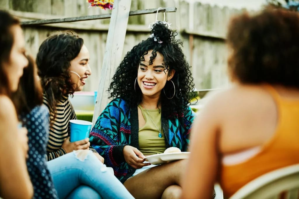 group of friends sitting outdoors LThJL.width .jpg