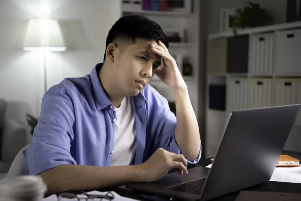 man s laptop stressed holding head gettyimages .jpg
