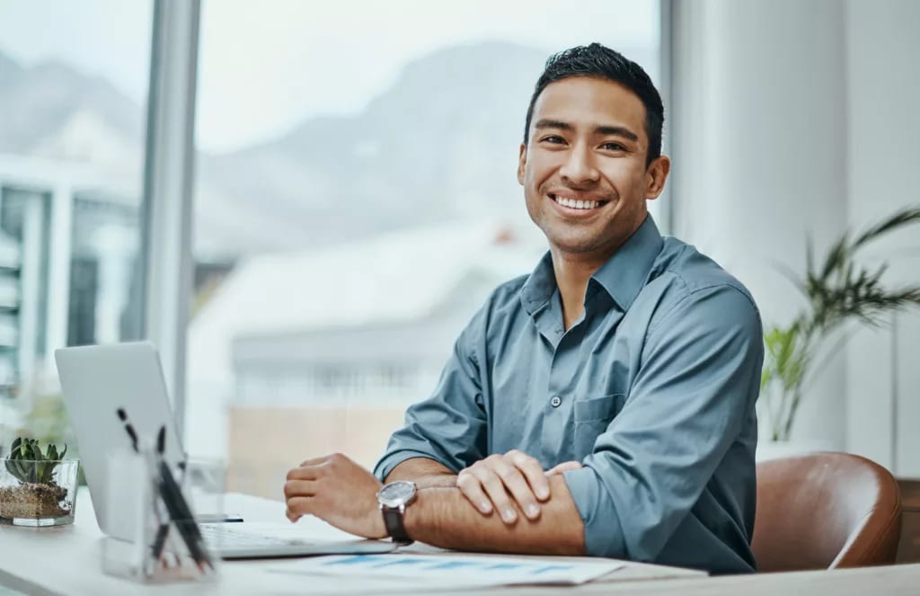 man s or s smiling laptop gettyimages .jpg