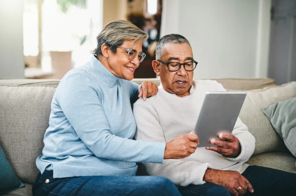 senior couple using a digital tablet at home.jpg