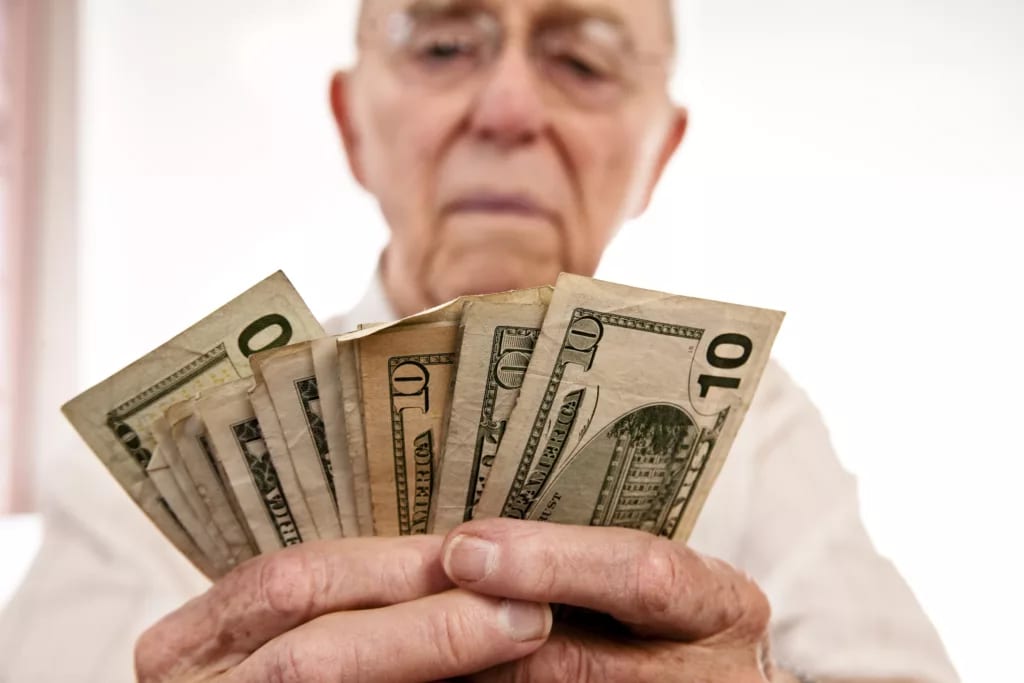 senior fanning cash retirement social security getty.jpg