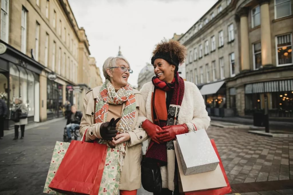 two women with shopping bags lkADAB.width .jpg