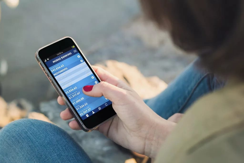 woman on smart phone using budgeting apps hce.width .jpg