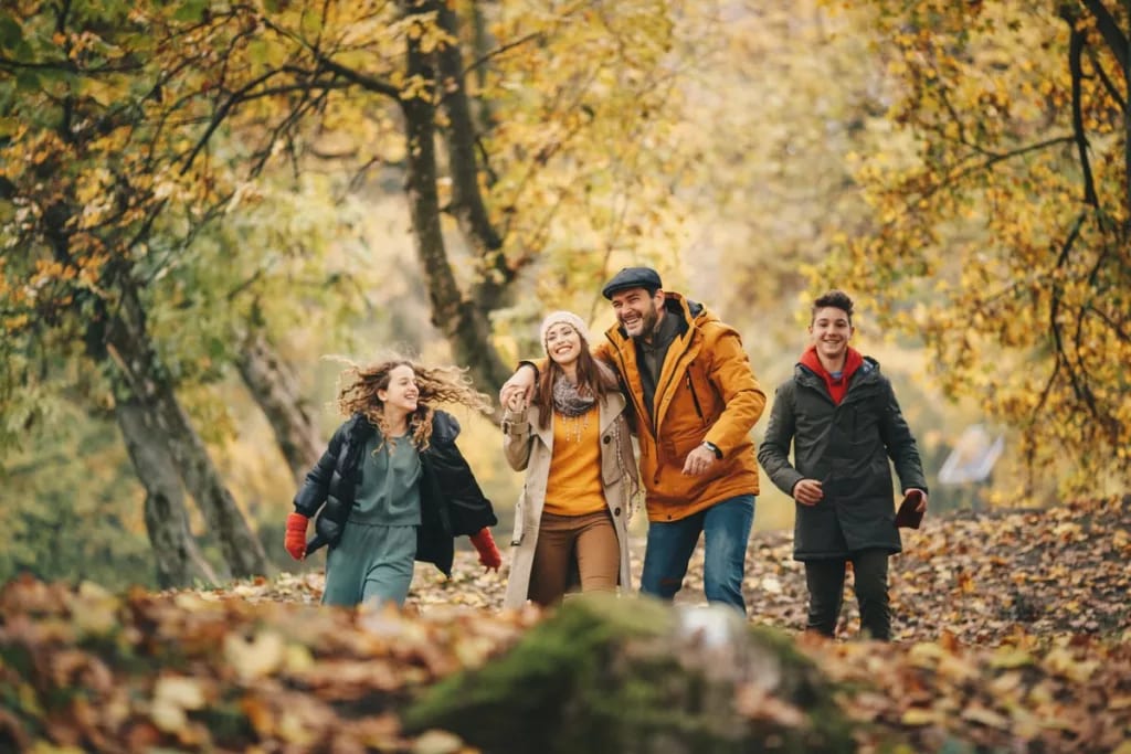 Family enjoys fall foliage in forest MiTiAHm.width .jpg