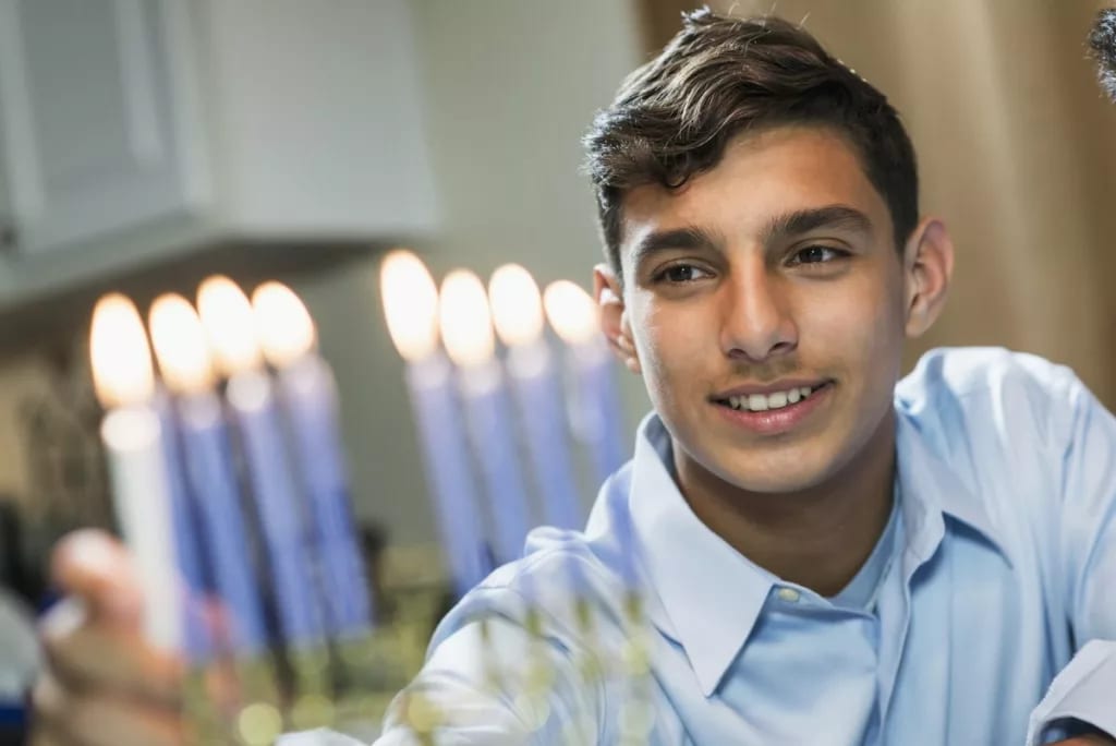 Hanukkah family celebrate Jewish holiday meno.width .jpg