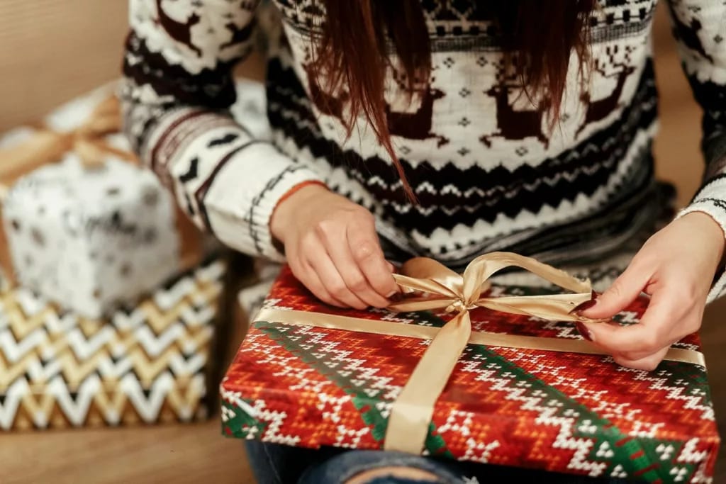 Woman wrapping gifts TpmzY.width .jpg