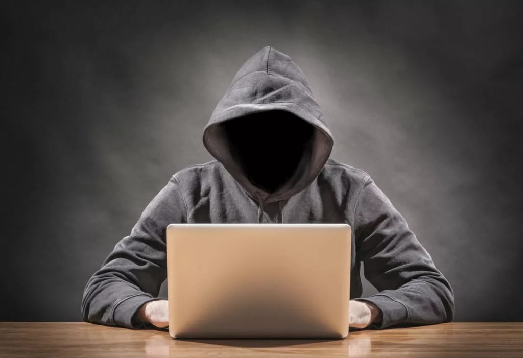 hacker in hoodie identity theft cyber securit.width RckAyD.jpg