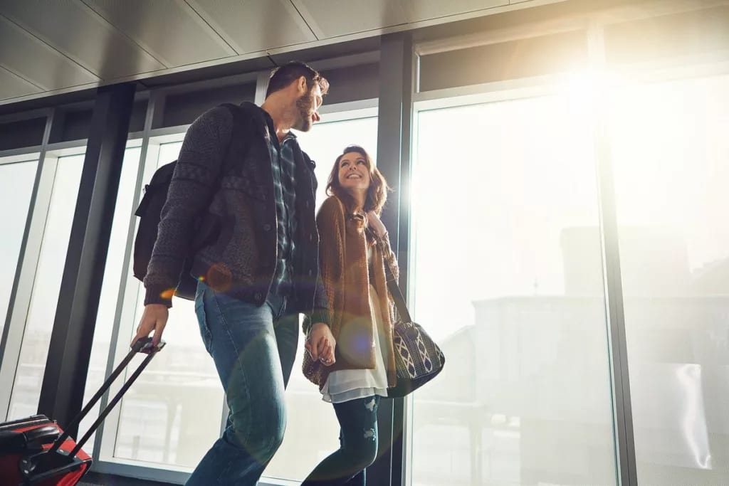 happy couple in airport nKEBue.width .jpg