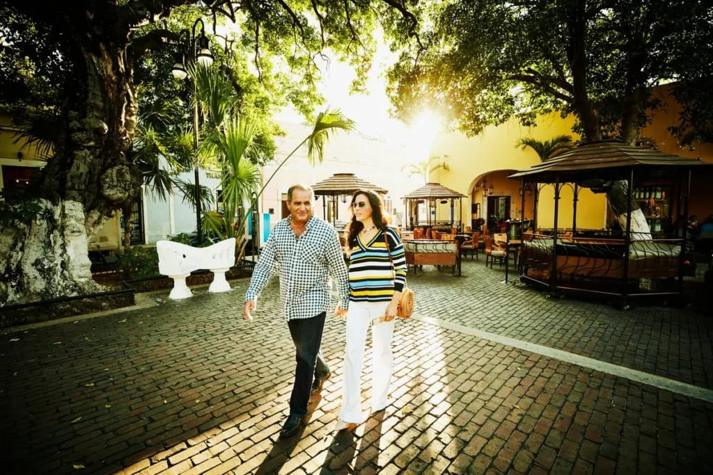 two people walking in courtyard uBaDEe.width .jpg