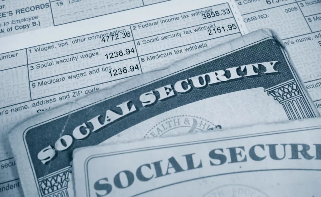 w tax form and social security cards payroll tax.jpg