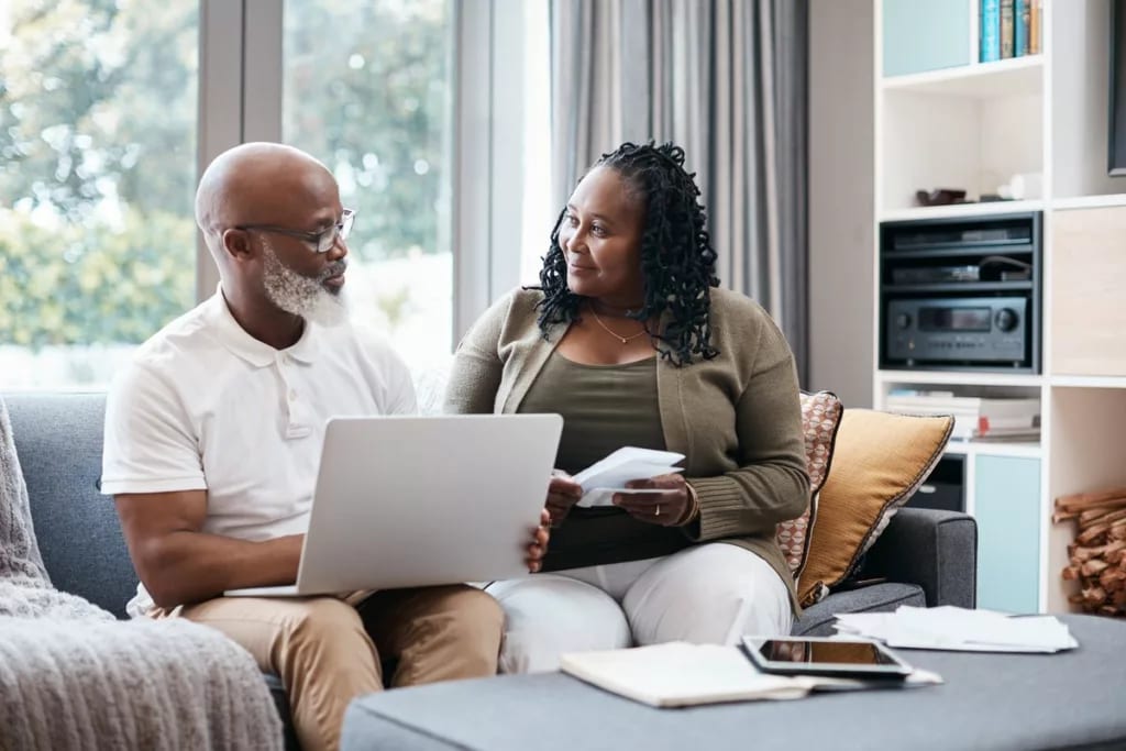 Senior couple sitting on couch together going.width Qvmomn.jpg