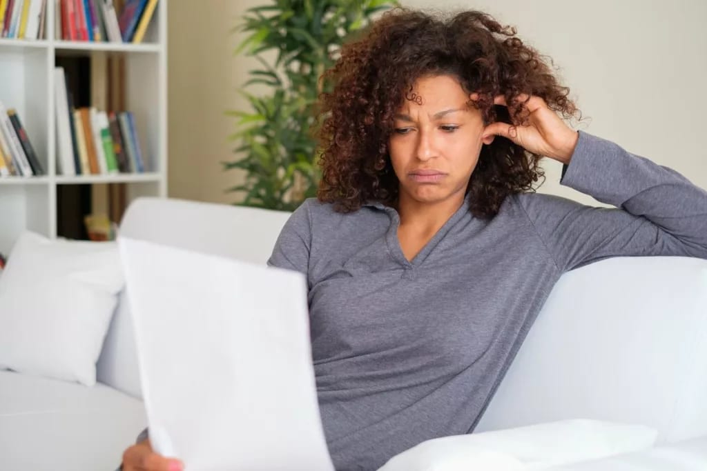 Stressed woman with paperwork dJzqjv.width .jpg