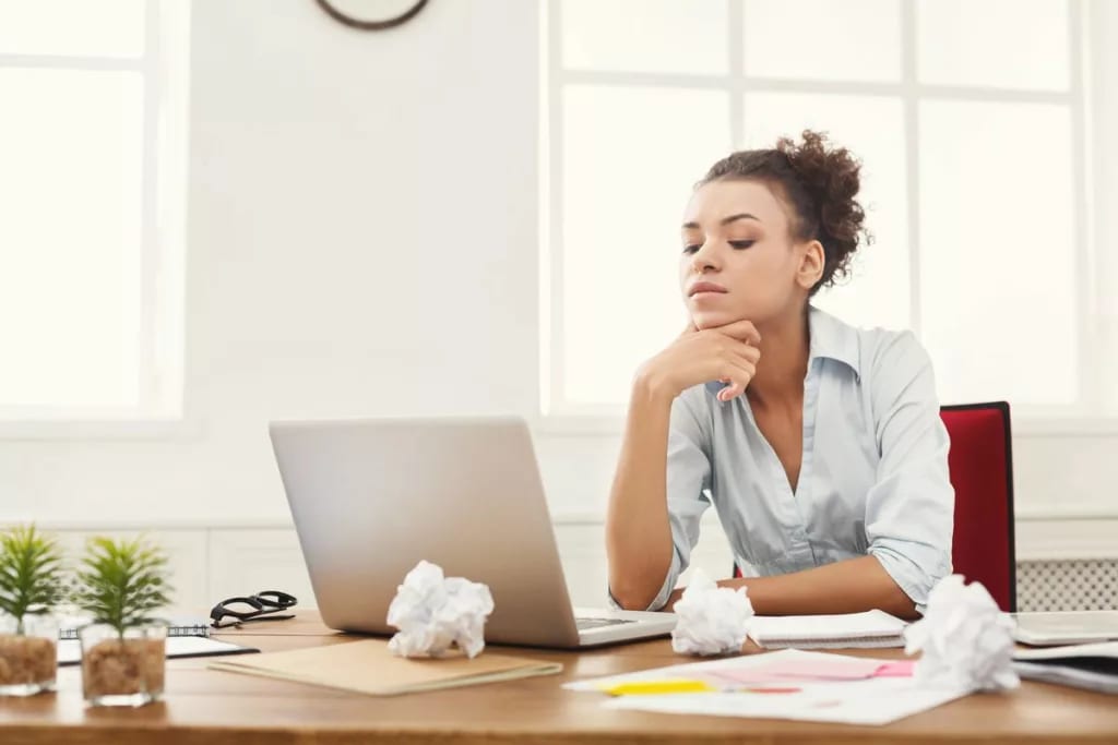 Young woman with laptop and bills OSnStY.width .jpg