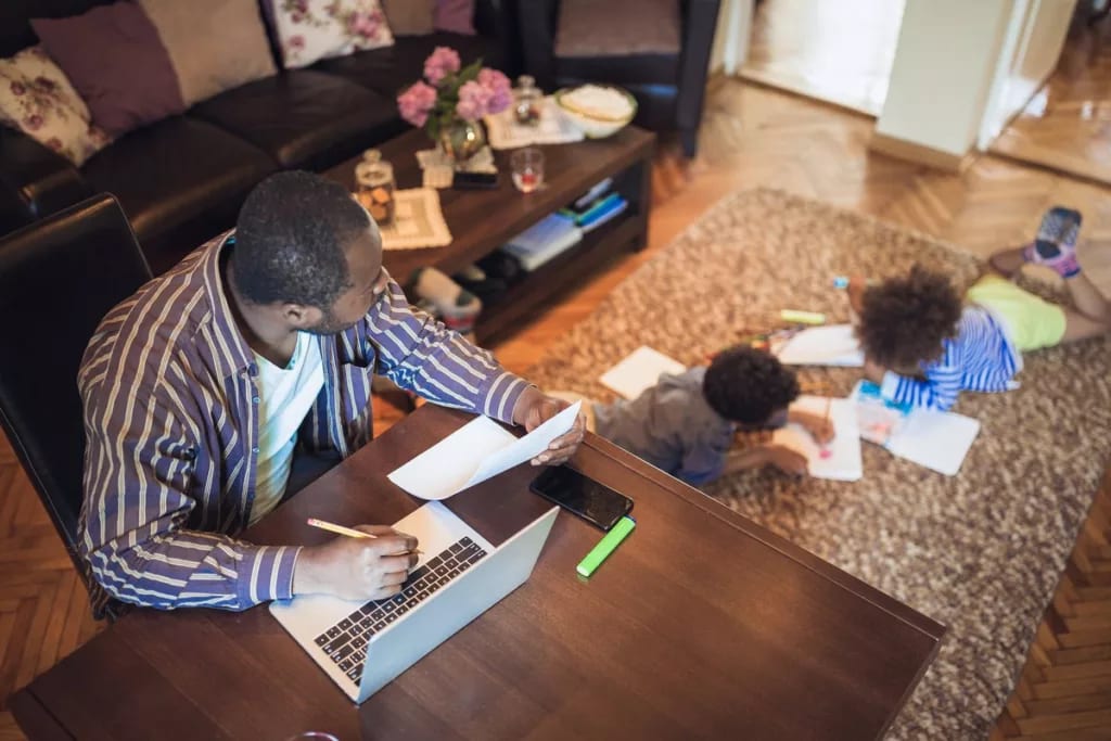 dad working from home watching kids.width .jpg