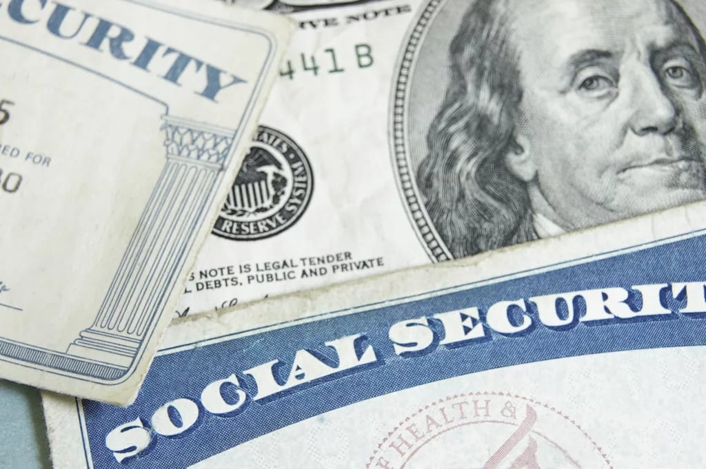 getty images social security card with money hundred bill.jpeg