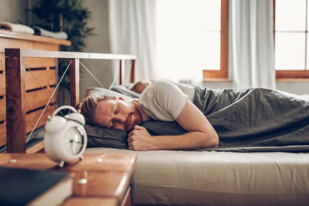 man sleeping in bed oRytPC.width .jpg