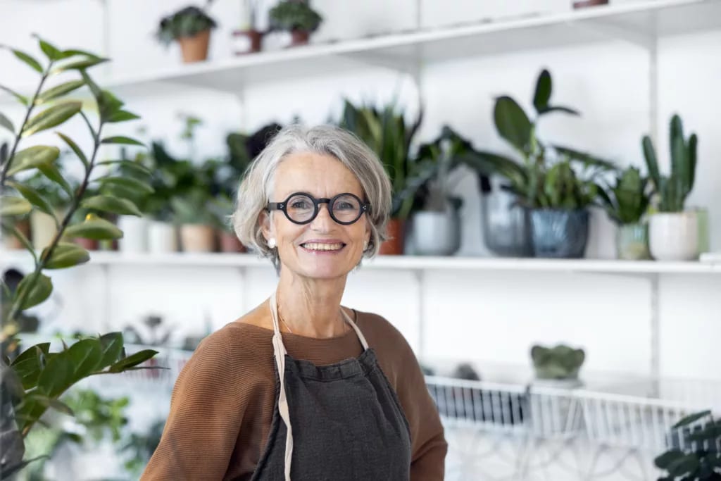 person smiling in a flower shop.jpg